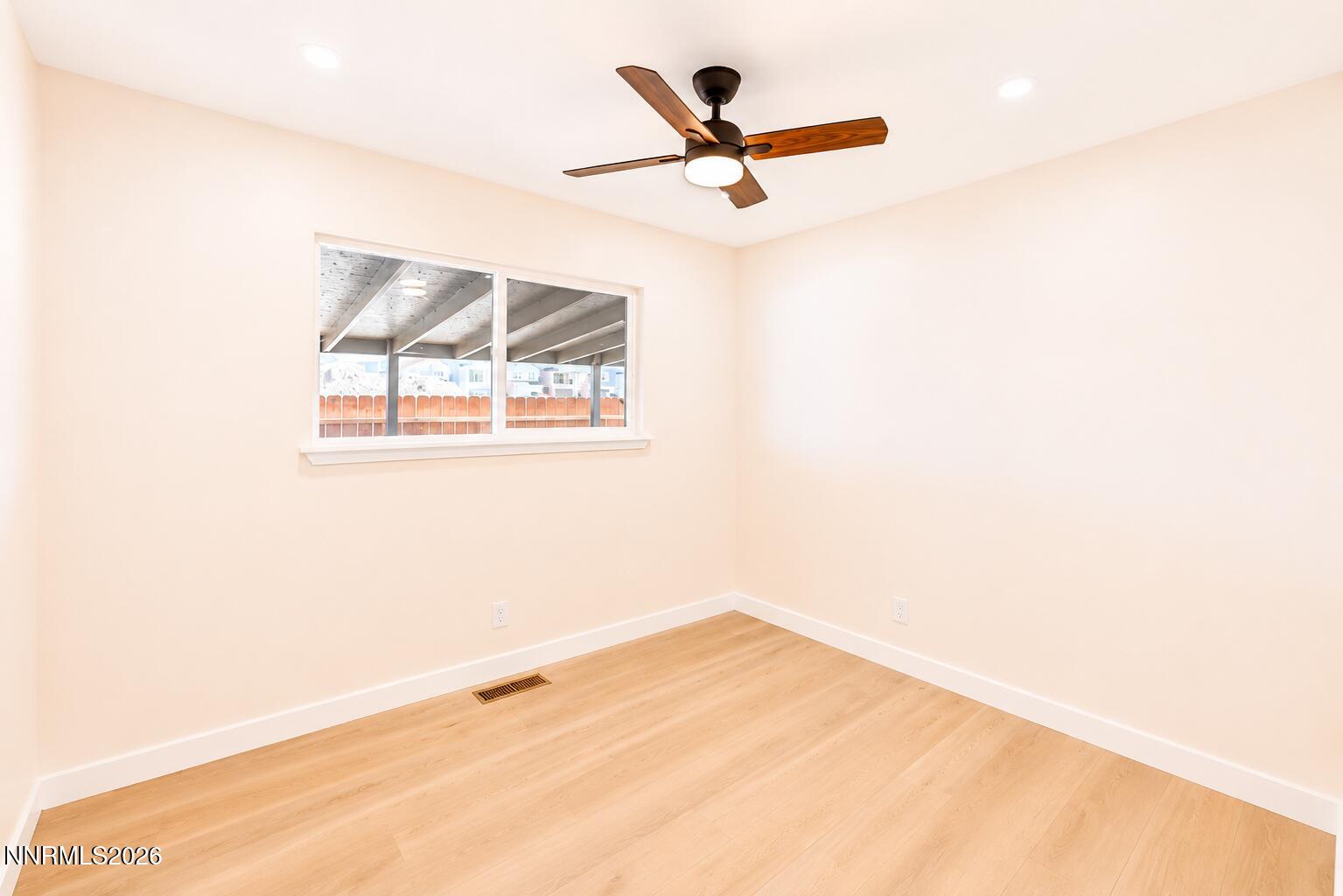 742 Ruth Street Carson City, NV 89701 - Photo 17 of 25 a view of a room with a window and a ceiling fan