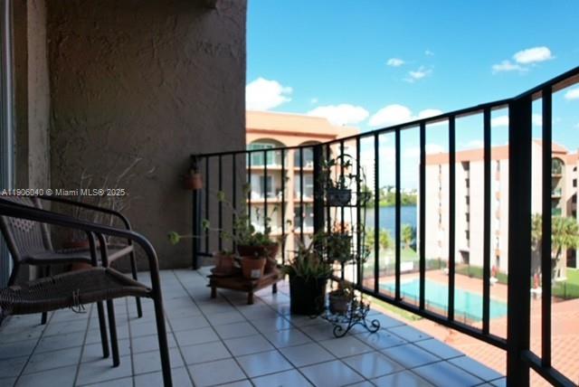 5201 Northwest 7th Street, Unit 507 Miami, FL 33126 - Photo 3 of 18 a view of a balcony with chairs