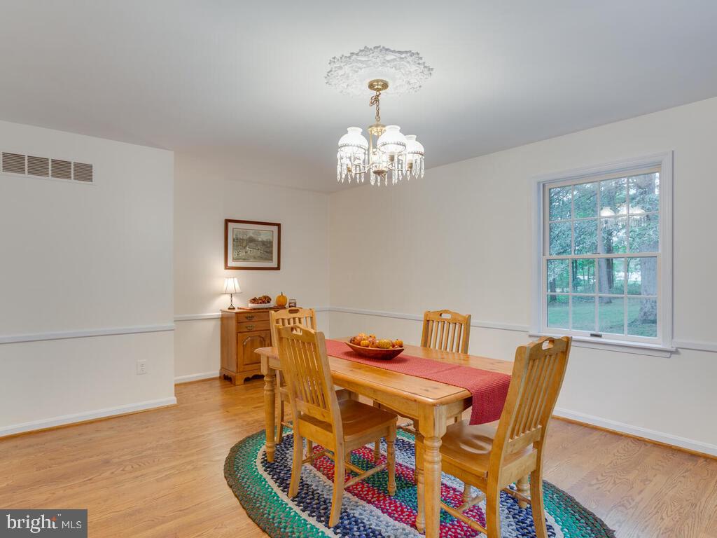 3619 Carrollton Road Upperco, MD 21155 - Photo 16 of 82 Chair rail, overhead chandelier