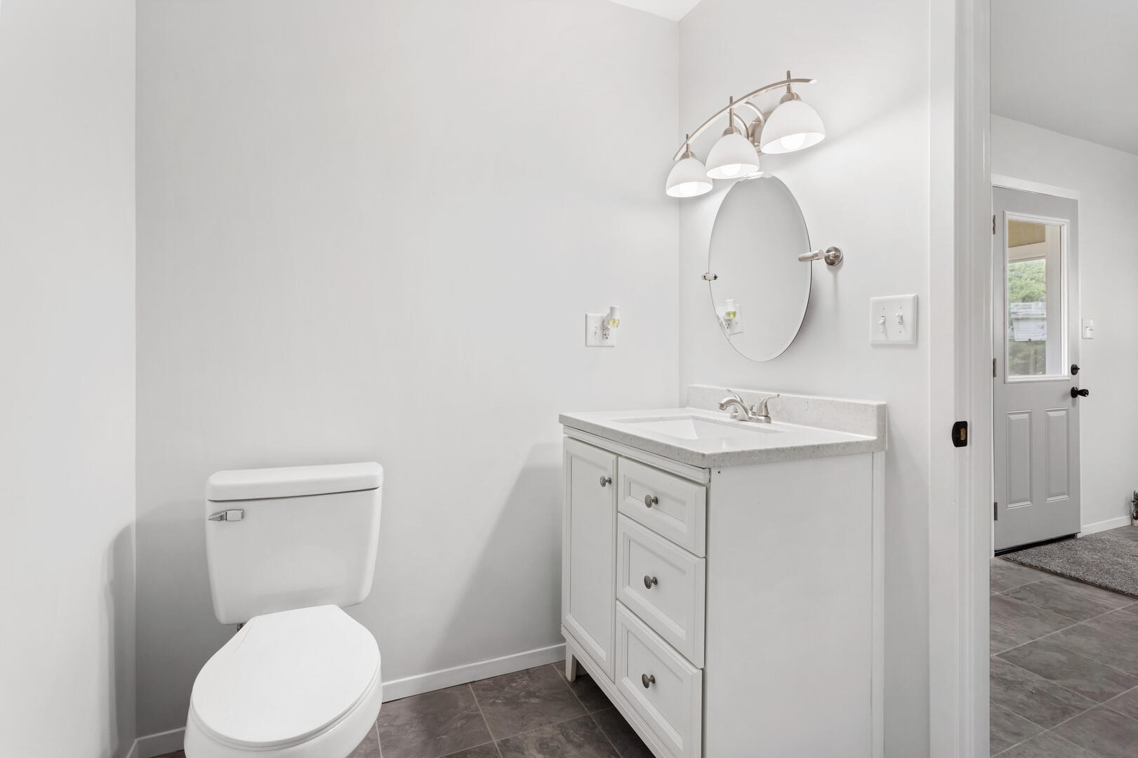 208 Maple Street Ogden, IL 61859 - Photo 13 of 30 a bathroom with a toilet sink and mirror
