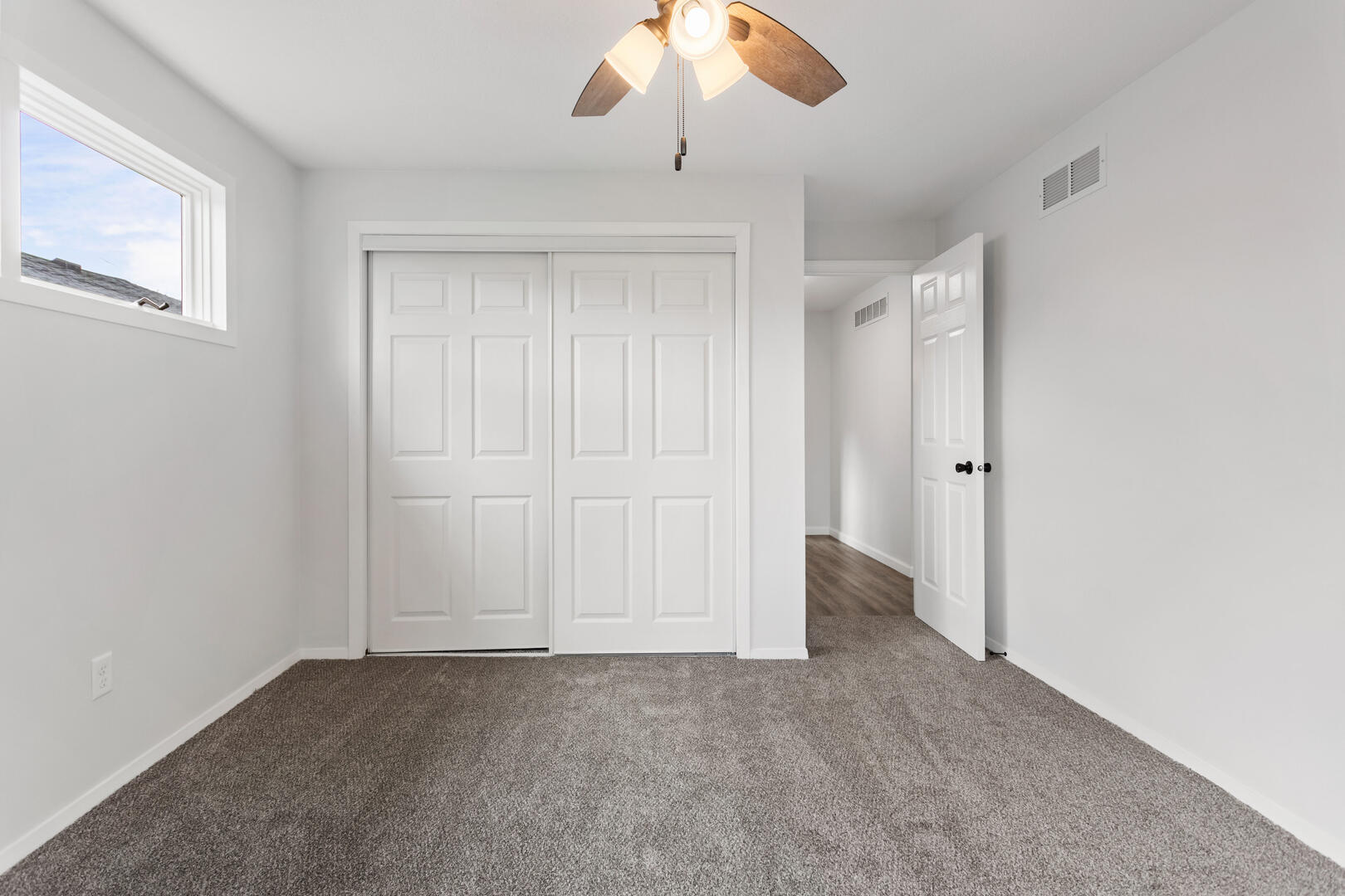 208 Maple Street Ogden, IL 61859 - Photo 16 of 30 an empty room with a ceiling fan
