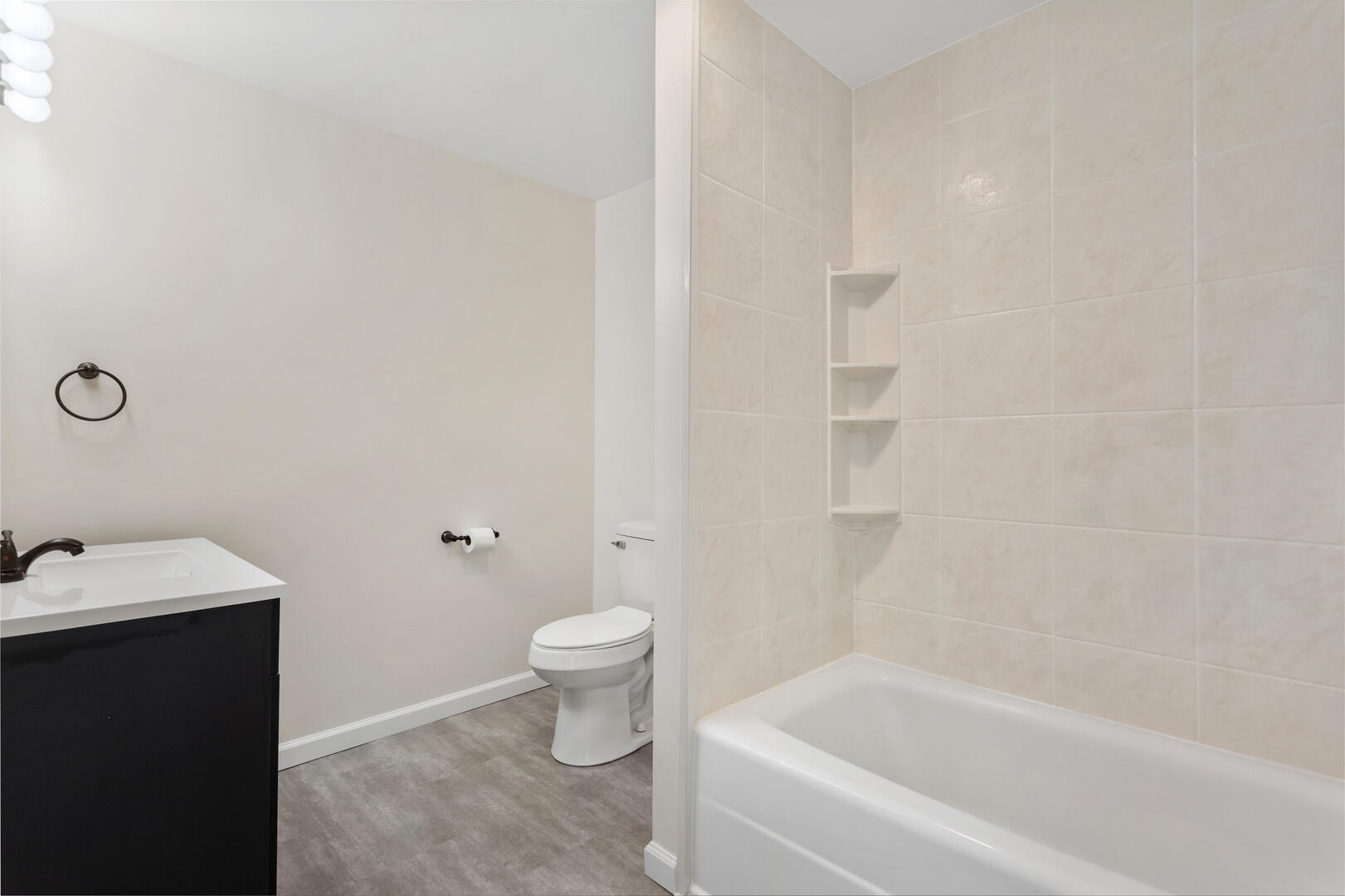 208 Maple Street Ogden, IL 61859 - Photo 17 of 30 a bathroom with a sink and a bathtub