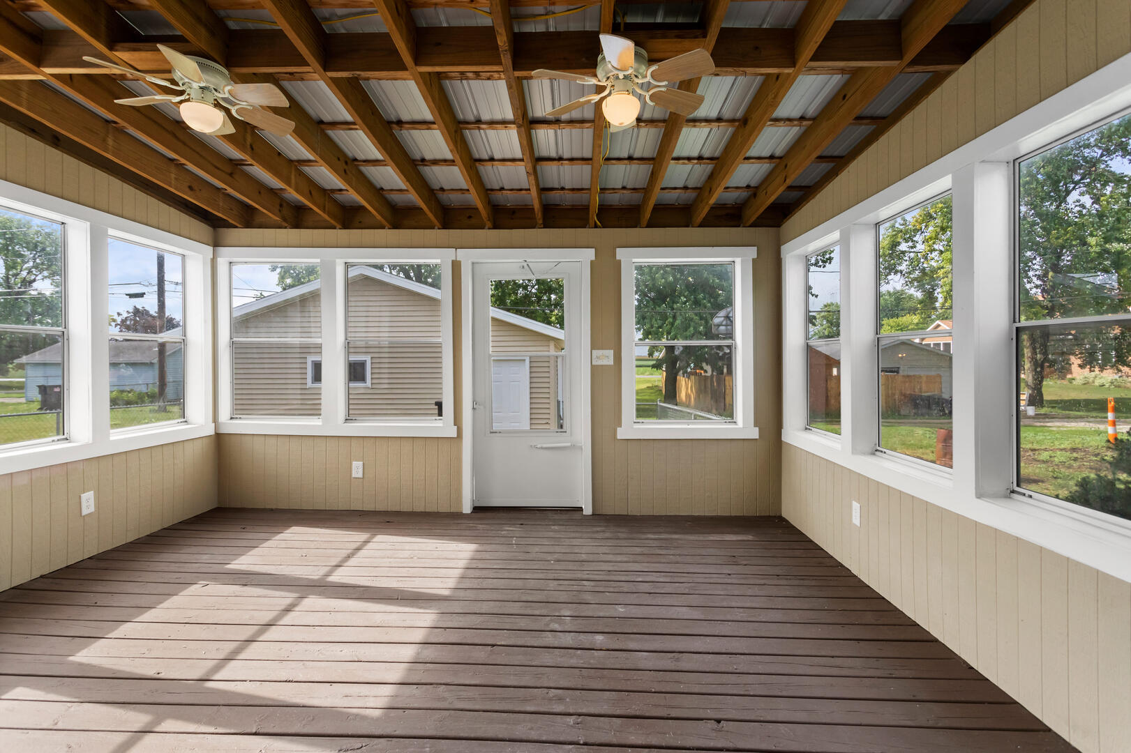 208 Maple Street Ogden, IL 61859 - Photo 24 of 30 a view of an empty room with wooden floor and a window