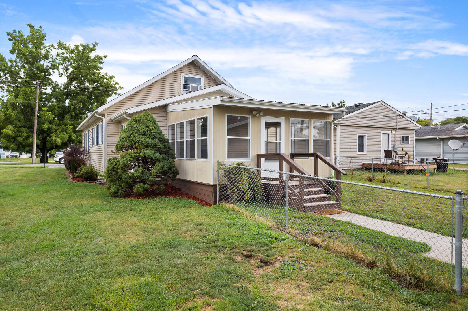 208 Maple Street Ogden, IL 61859 - Photo 26 of 30 a front view of a house with garden