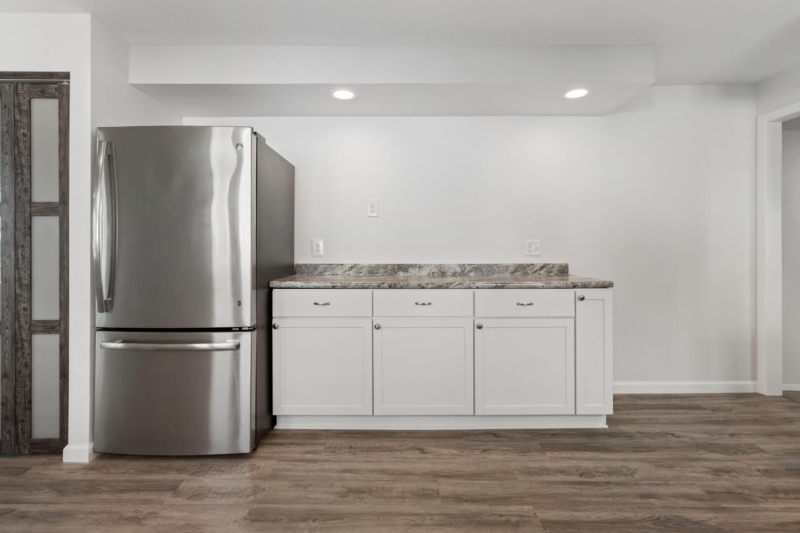 208 Maple Street Ogden, IL 61859 - Photo 9 of 30 a metallic refrigerator freezer sitting in a kitchen