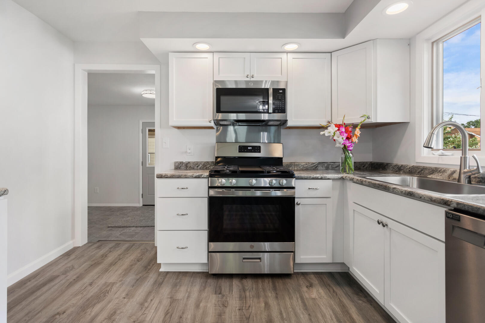 208 Maple Street Ogden, IL 61859 - Photo 10 of 30 a kitchen with a stove and a microwave