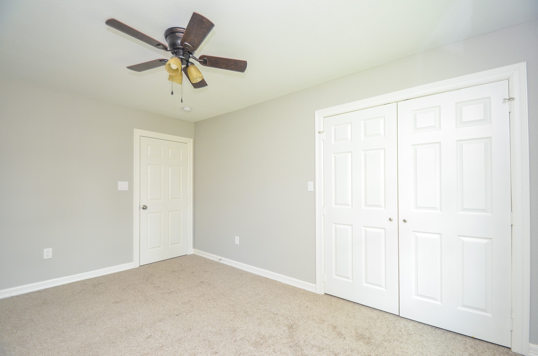 6114 Wedgefield Street Houston, TX 77028 - Photo 14 of 32 an empty room with a ceiling fan