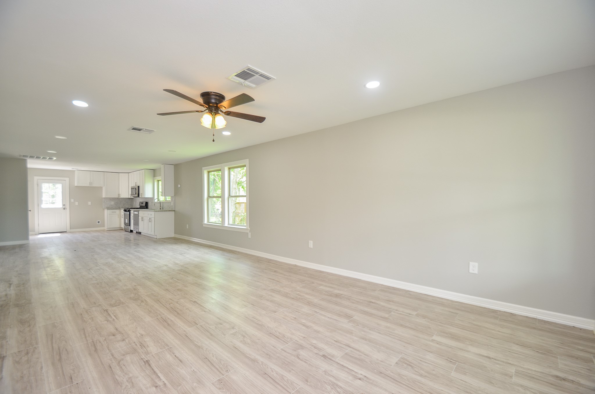 6114 Wedgefield Street Houston, TX 77028 - Photo 18 of 32 a view of an empty room with a window