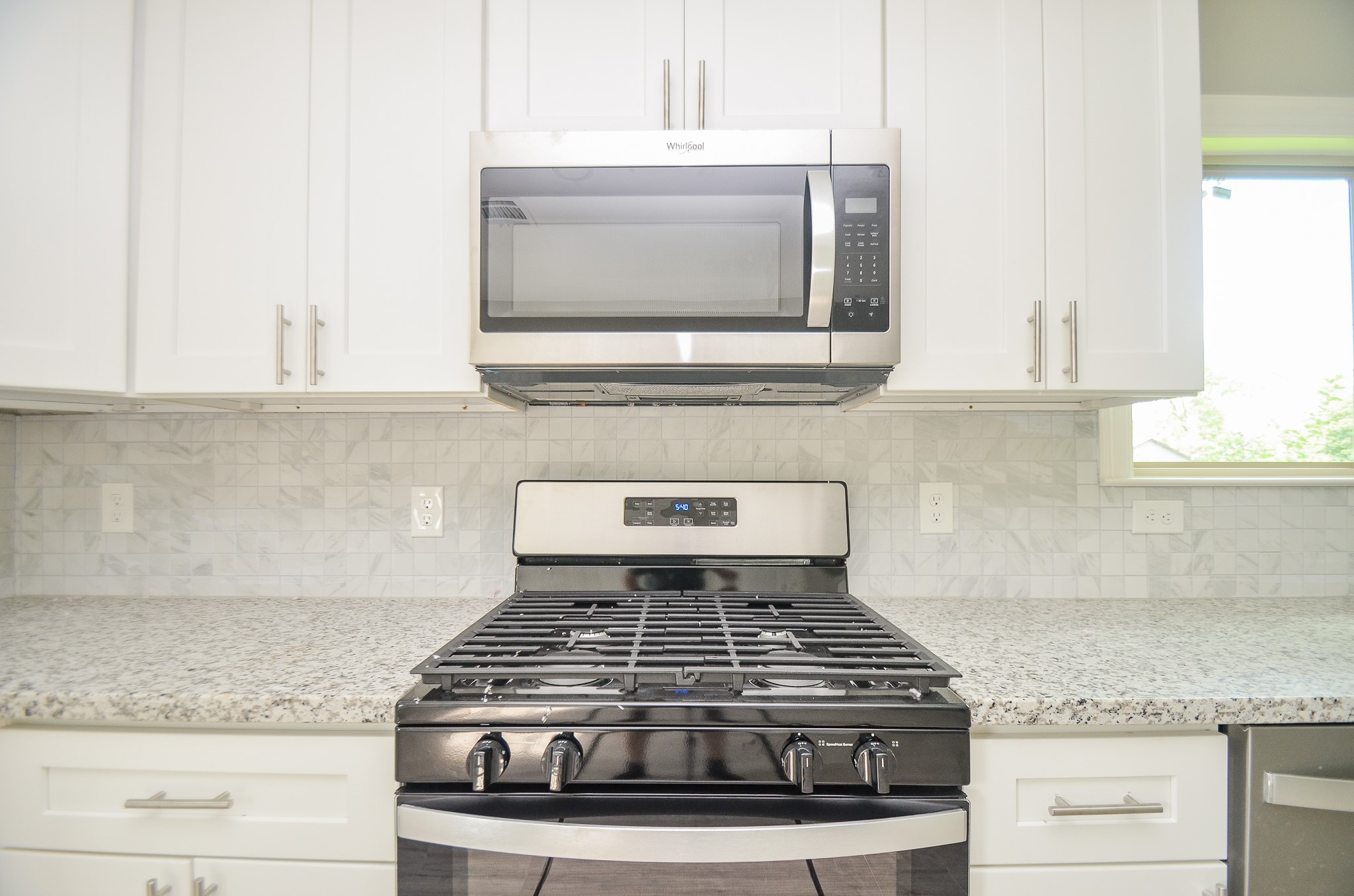 6114 Wedgefield Street Houston, TX 77028 - Photo 23 of 32 a stove top oven sitting inside of a kitchen
