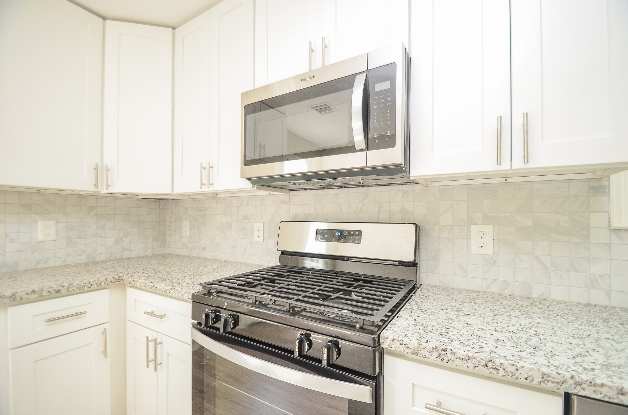 6114 Wedgefield Street Houston, TX 77028 - Photo 25 of 32 a stove top oven sitting inside of a kitchen