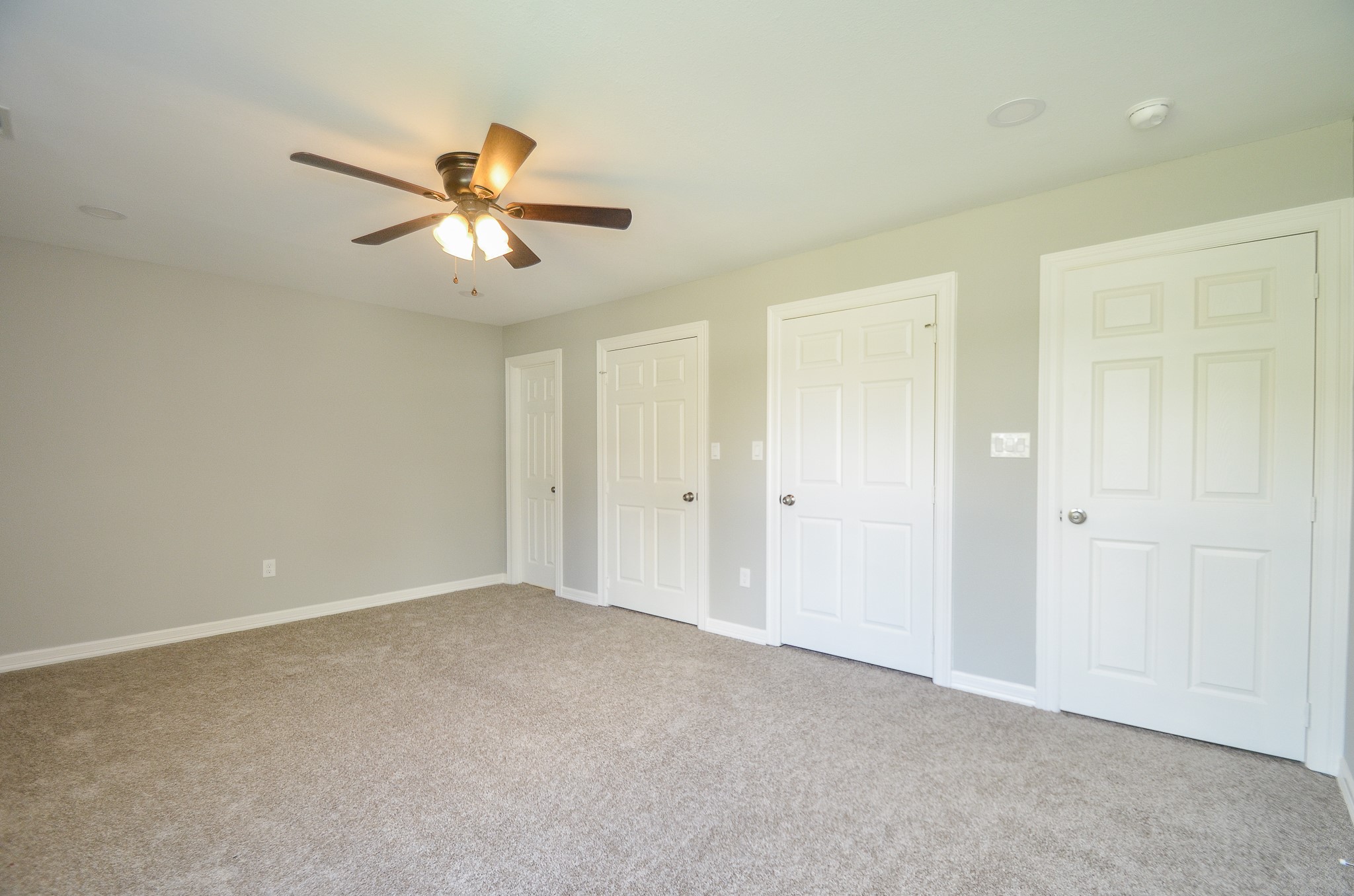 6114 Wedgefield Street Houston, TX 77028 - Photo 4 of 32 a view of a room with a ceiling fan and a window