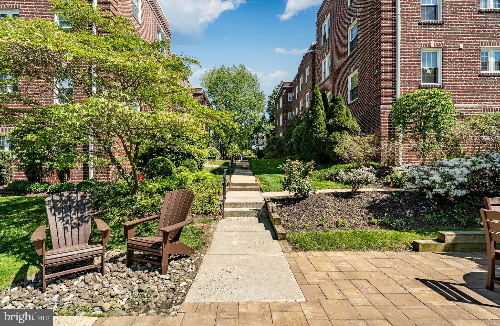 104 Woodside Road, Unit A102 Haverford, PA 19041 - Photo 36 of 46 Walkway from Pool and Additional Parking