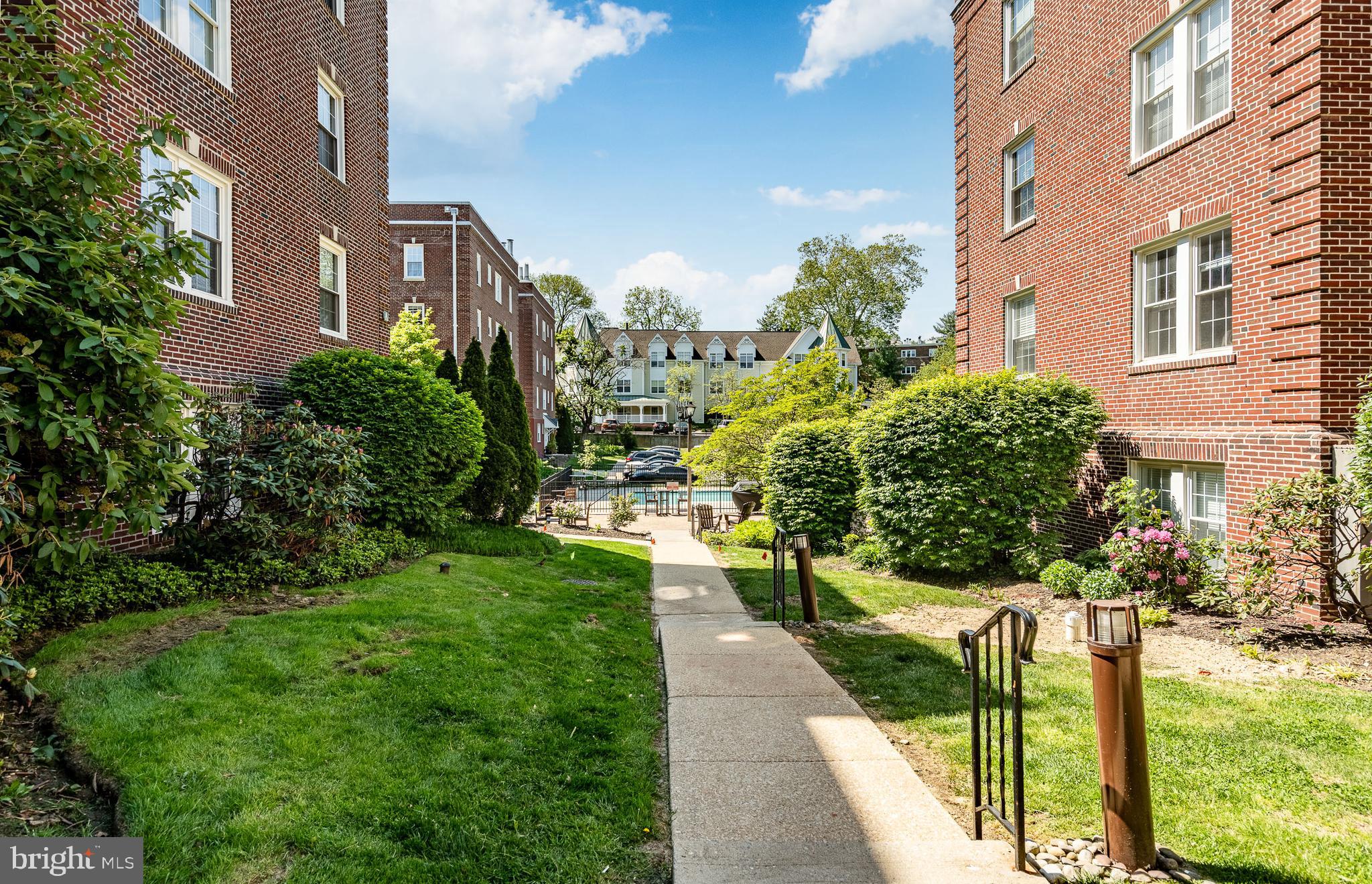 104 Woodside Road, Unit A102 Haverford, PA 19041 - Photo 37 of 46 Walkway to Pool and Additional Parking