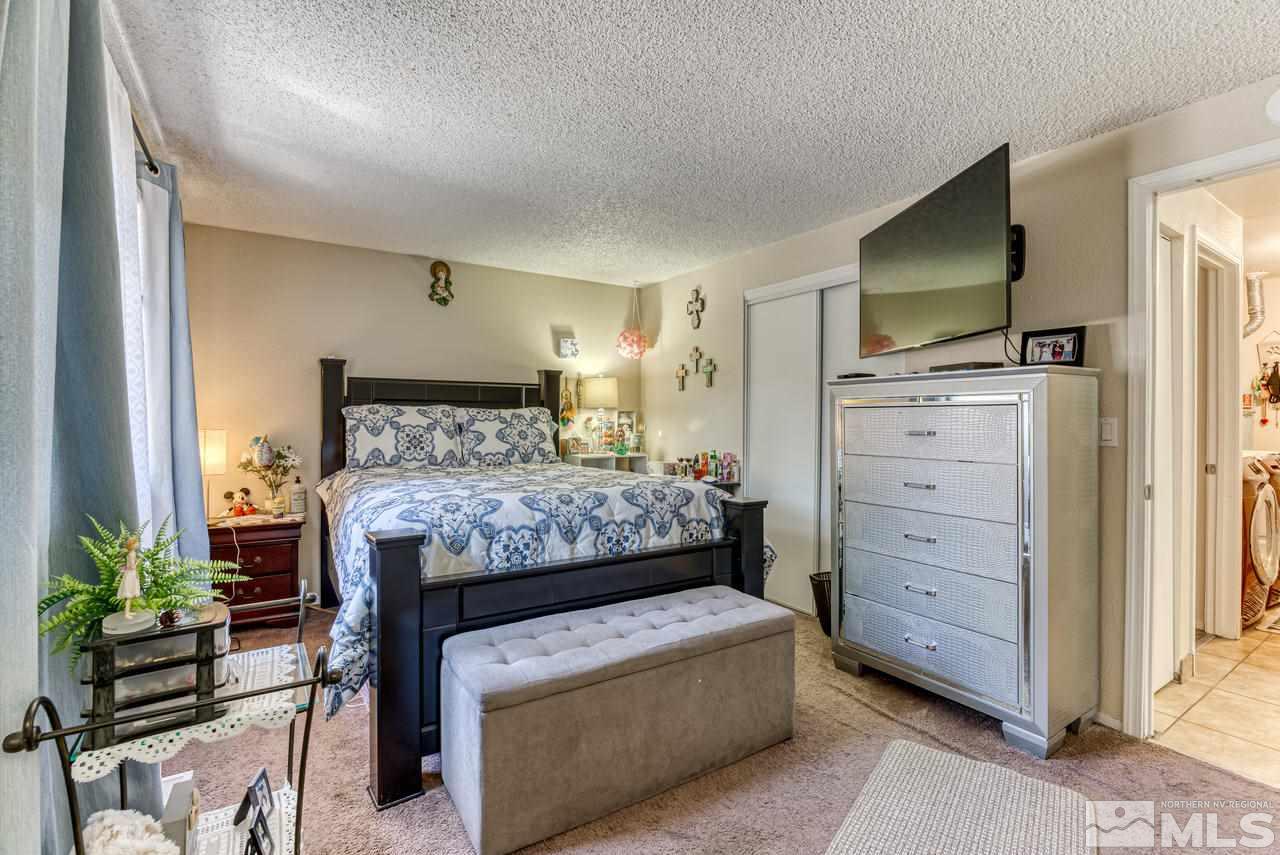 12085 Kernite Street Reno, NV 89506 - Photo 14 of 29 a bedroom with a bed and furniture