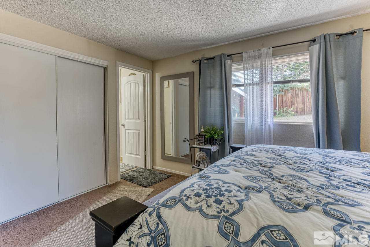 12085 Kernite Street Reno, NV 89506 - Photo 15 of 29 a bedroom with a bed and a window