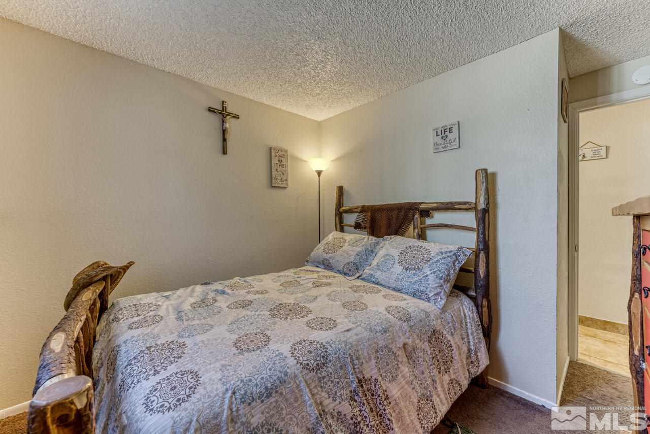 12085 Kernite Street Reno, NV 89506 - Photo 17 of 29 a bedroom with a bed and a window