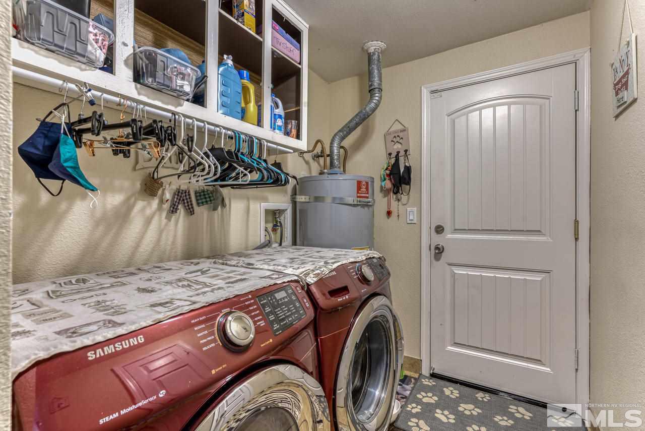 12085 Kernite Street Reno, NV 89506 - Photo 19 of 29 a utility room with dryer and washer