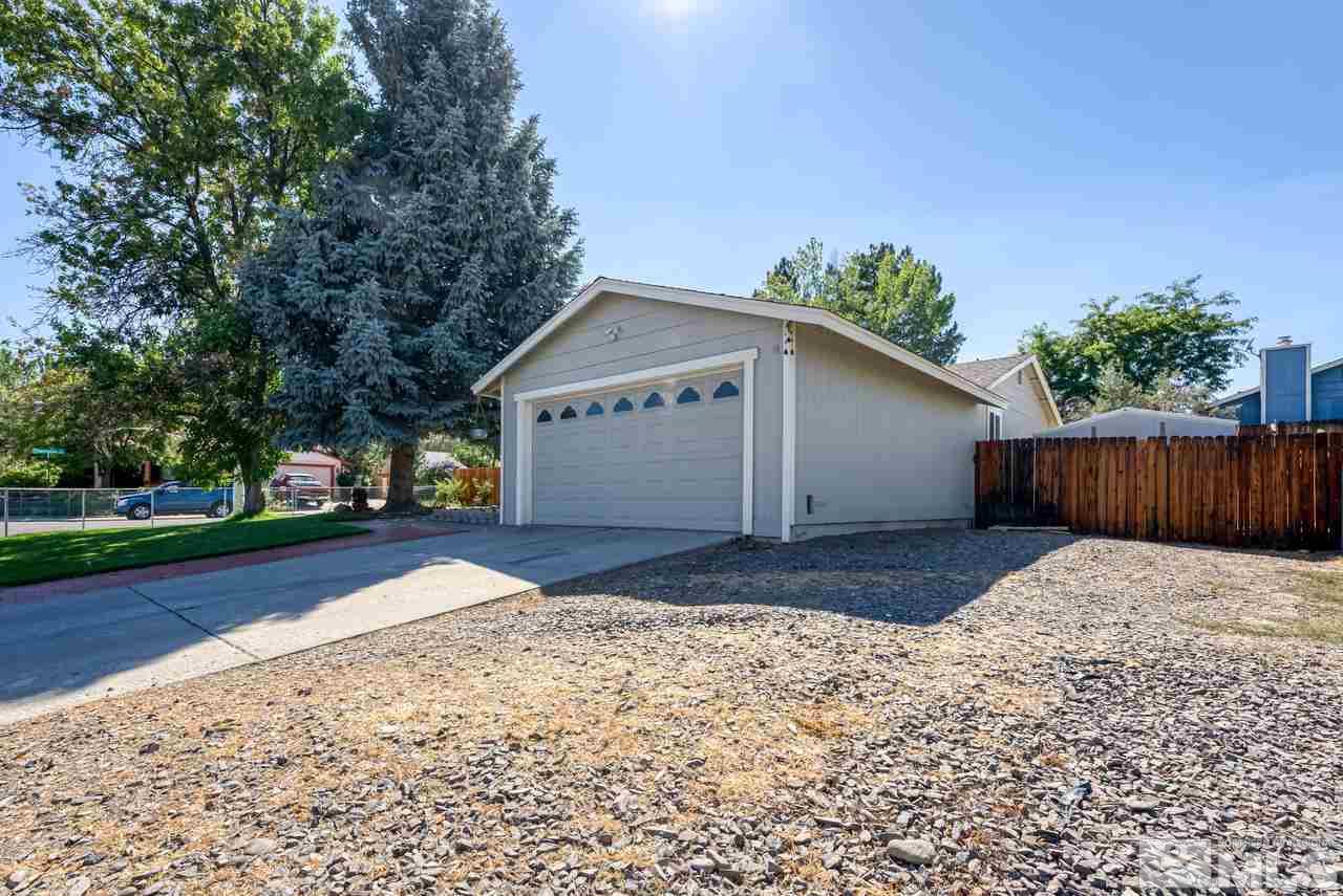 12085 Kernite Street Reno, NV 89506 - Photo 2 of 29 a view of backyard of house with wooden fence