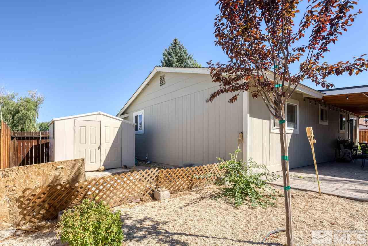 12085 Kernite Street Reno, NV 89506 - Photo 23 of 29 a view of a house with a tree