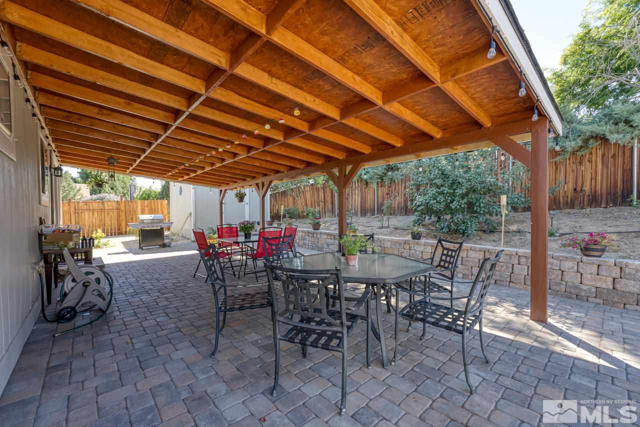 12085 Kernite Street Reno, NV 89506 - Photo 25 of 29 a view of a dinning table and chairs in the patio