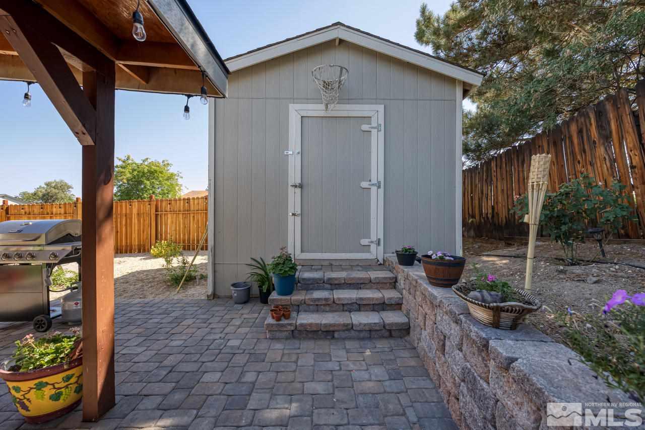 12085 Kernite Street Reno, NV 89506 - Photo 27 of 29 a view of a house with backyard and sitting area