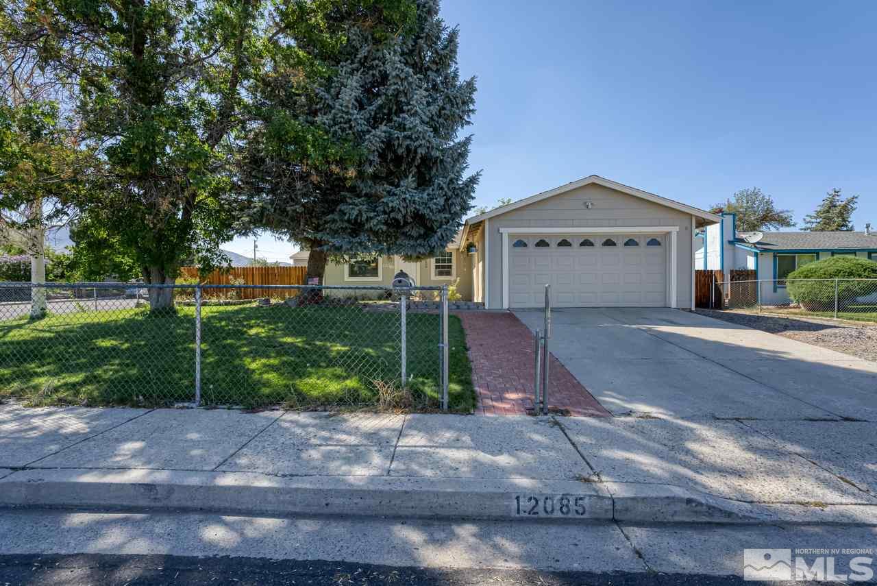 12085 Kernite Street Reno, NV 89506 - Photo 3 of 29 a front view of a house with garden