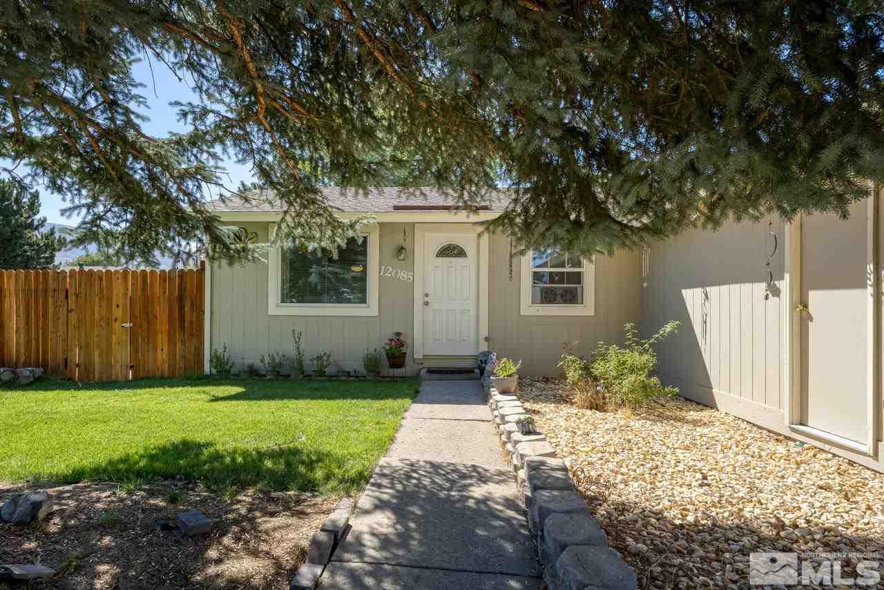 12085 Kernite Street Reno, NV 89506 - Photo 4 of 29 a front view of a house with a yard