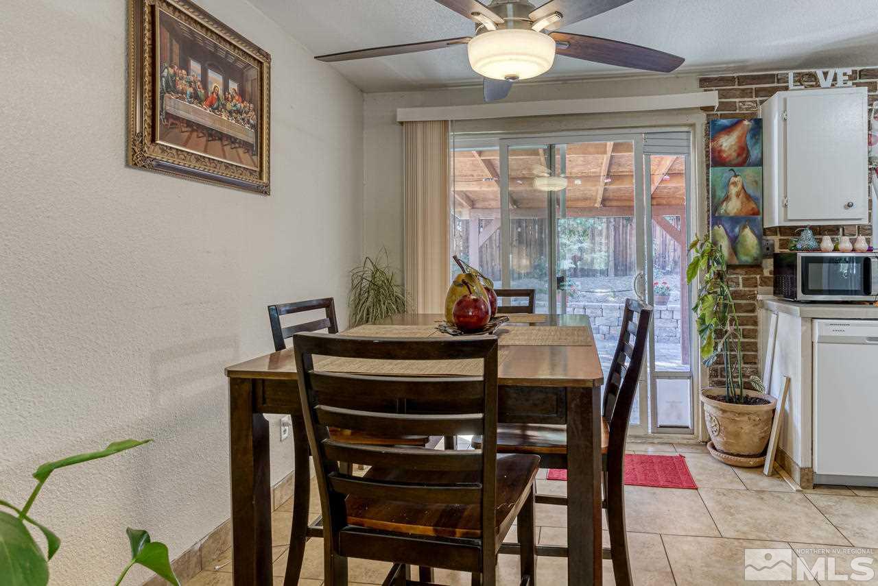 12085 Kernite Street Reno, NV 89506 - Photo 8 of 29 a view of a dining room with furniture window and outside view