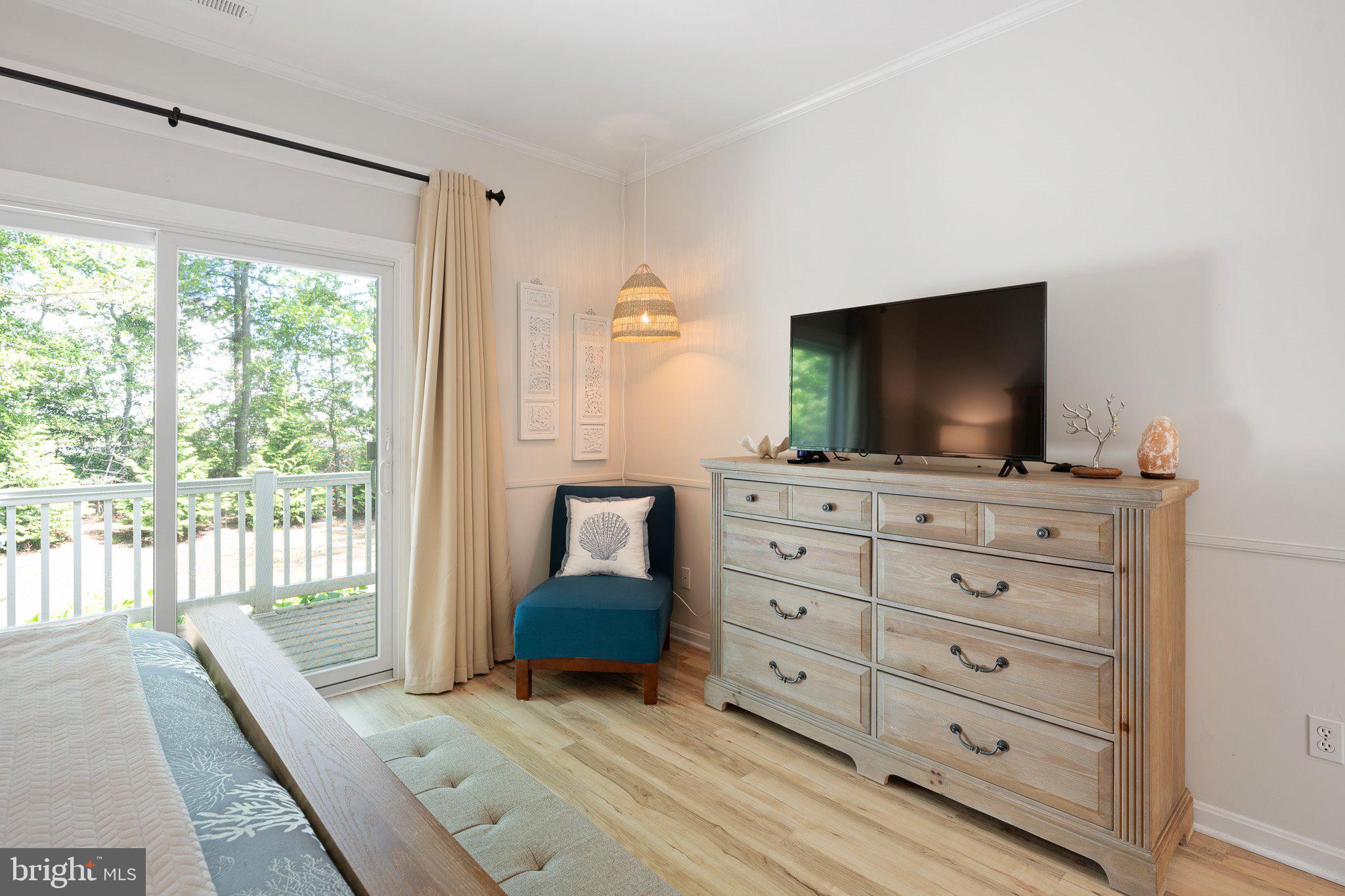 718 Foxtail Drive Bethany Beach, DE 19930 - Photo 17 of 39 a living room with furniture and flat screen tv