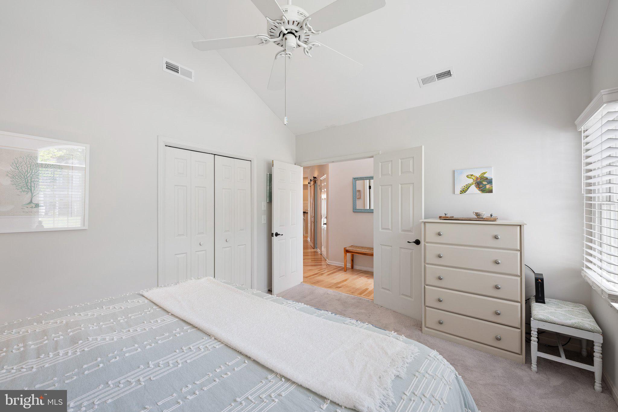 718 Foxtail Drive Bethany Beach, DE 19930 - Photo 22 of 39 a bedroom with a bed and a dresser in it