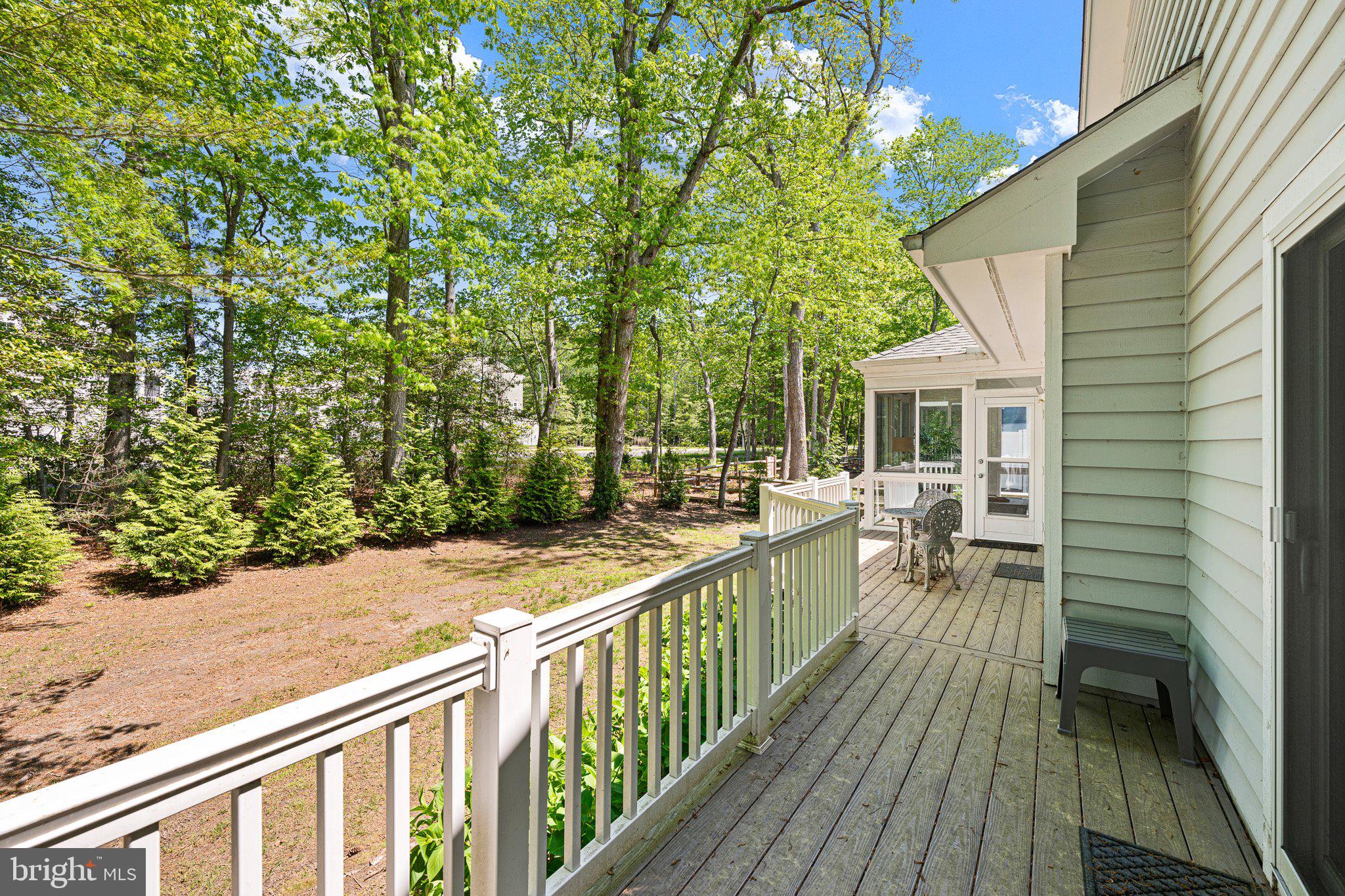 718 Foxtail Drive Bethany Beach, DE 19930 - Photo 30 of 39 a balcony with wooden floor and furniture