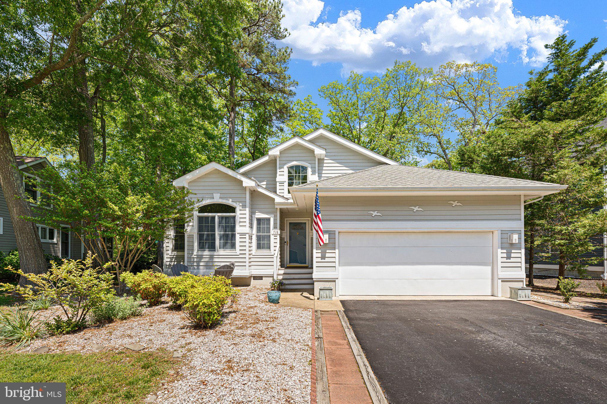 718 Foxtail Drive Bethany Beach, DE 19930 - Photo 33 of 39 a front view of a house with a yard