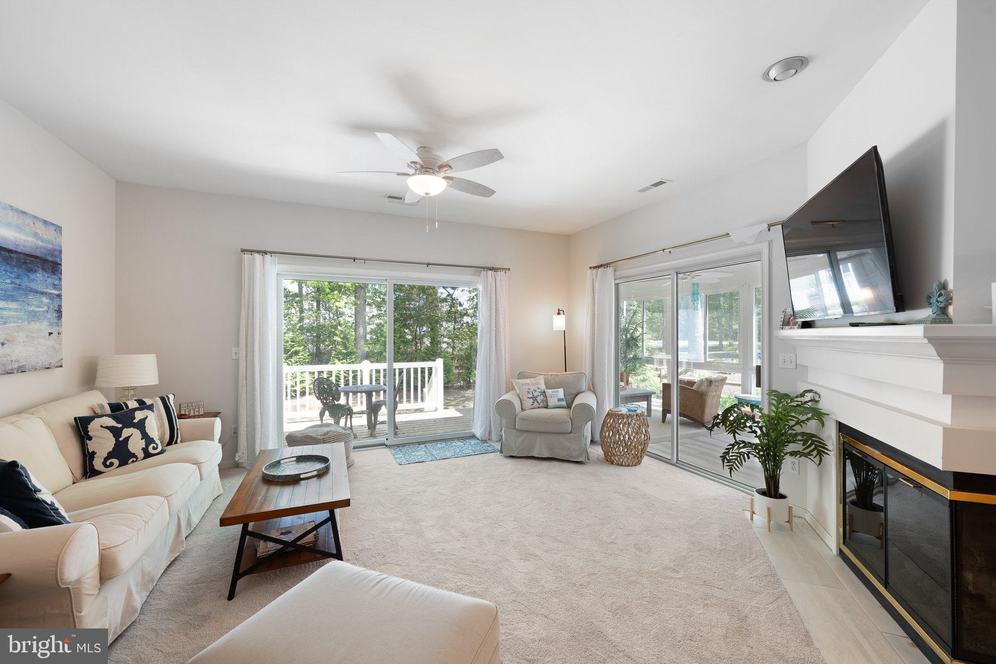 718 Foxtail Drive Bethany Beach, DE 19930 - Photo 7 of 39 a living room with furniture fireplace and flat screen tv