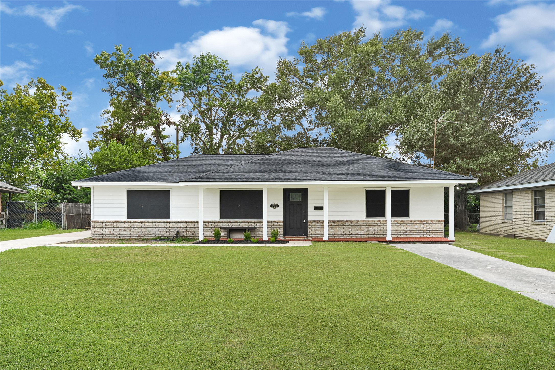 a house view with a garden space