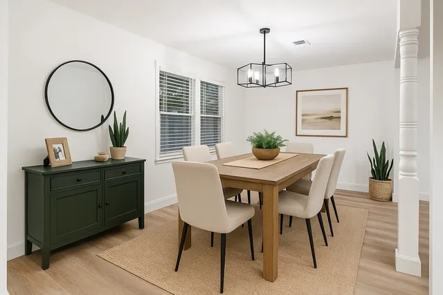 a dining room with furniture a window and a chandelier