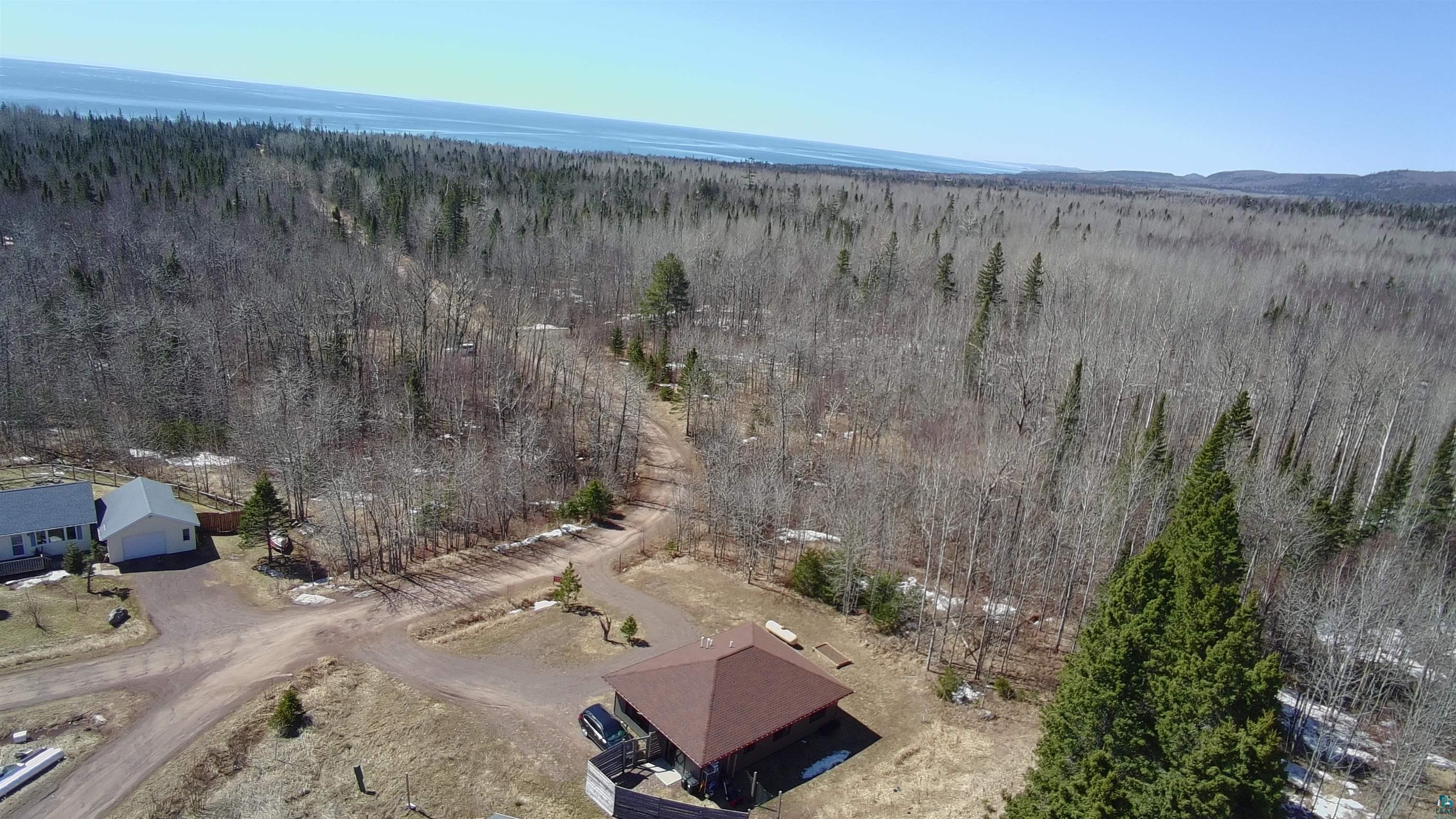 265 Mink Ranch Road Lutsen, MN 55612 - Photo 35 of 36 Expansive wooded acreage with a distant body of water