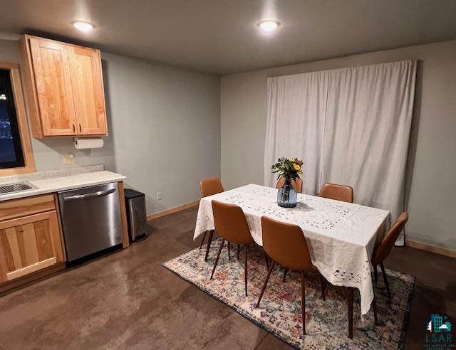 265 Mink Ranch Road Lutsen, MN 55612 - Photo 5 of 25 Dining space with finished concrete flooring and baseboards