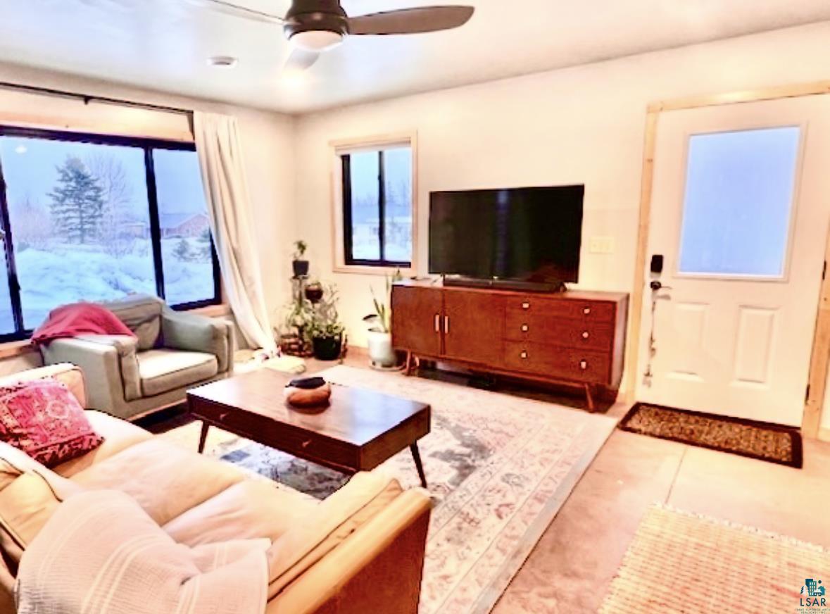 265 Mink Ranch Road Lutsen, MN 55612 - Photo 7 of 25 Living area with ceiling fan