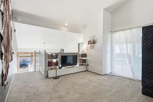 a bathroom with a granite countertop toilet sink and mirror