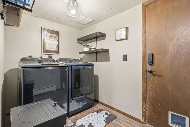 a bathroom with a sink vanity mirror toilet and bathtub