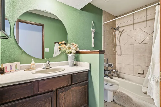 a bedroom with furniture and a shower