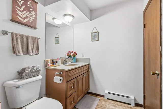 a white toilet sitting next to a bathroom sink