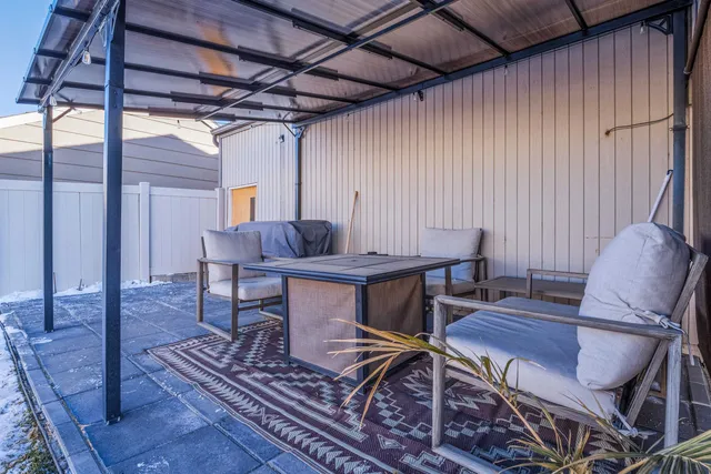 a view of a room with furniture wooden floor and a rug