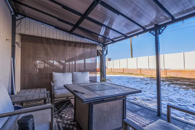 a living room with furniture and a table