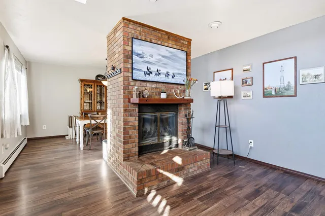 a view of a livingroom with furniture and an empty room