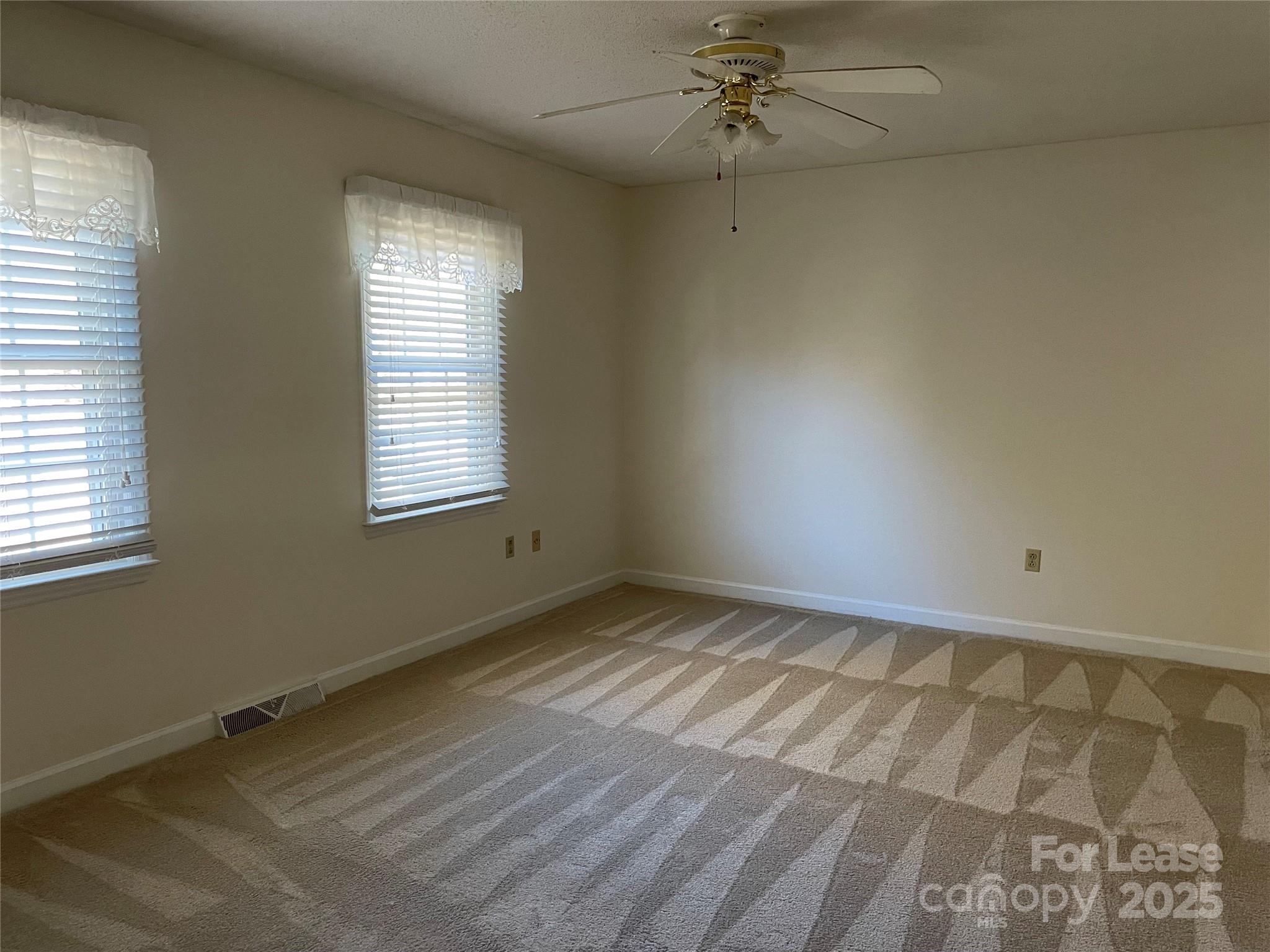 7327 Ricewell Road Charlotte, NC 28226 - Photo 16 of 22 a view of an empty room and window