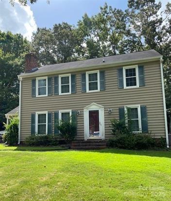 7327 Ricewell Road Charlotte, NC 28226 - Photo 3 of 22 a front view of a house with garden