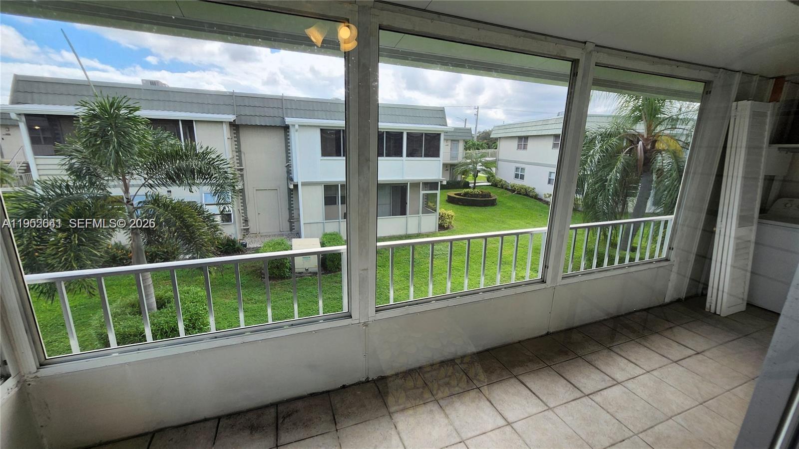 756 Flanders P Delray Beach, Unit 756 Delray Beach, FL 33484 - Photo 14 of 46 a view of a house with a balcony