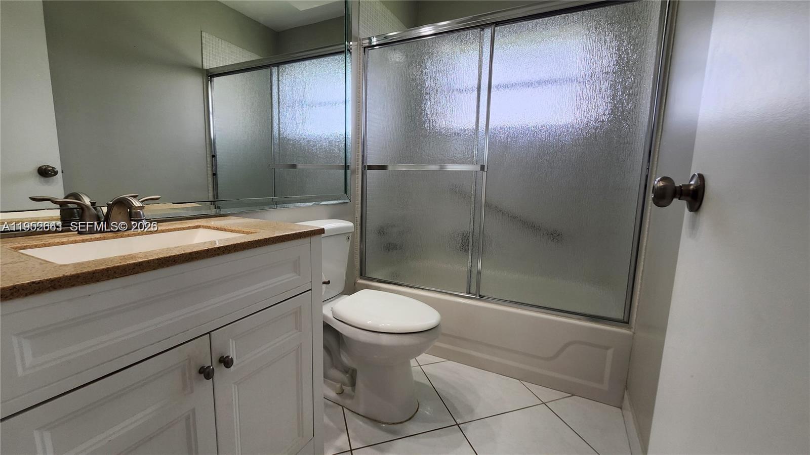 756 Flanders P Delray Beach, Unit 756 Delray Beach, FL 33484 - Photo 19 of 46 a bathroom with a sink toilet and shower