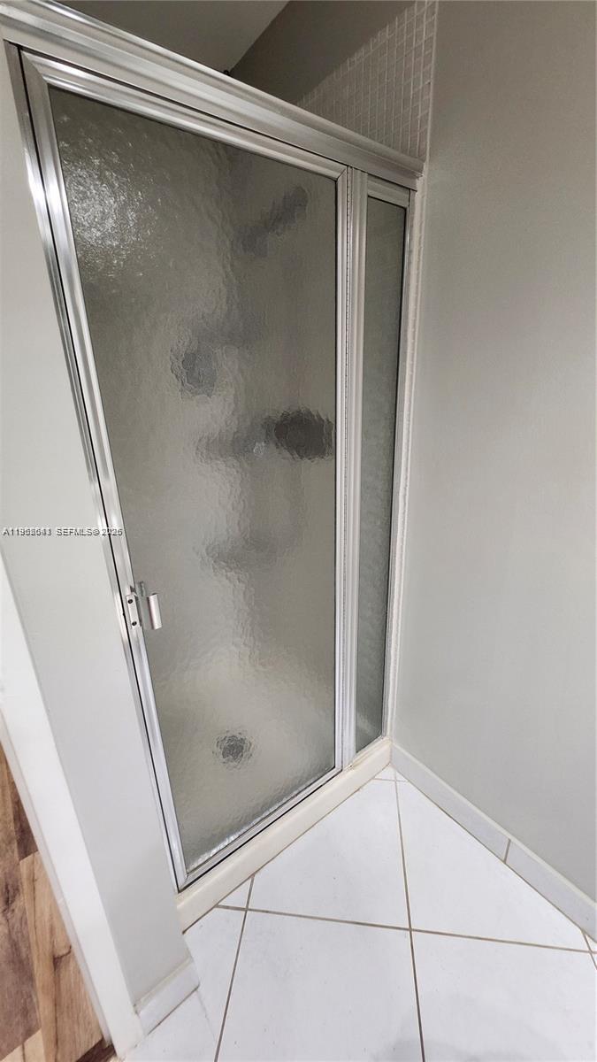 756 Flanders P Delray Beach, Unit 756 Delray Beach, FL 33484 - Photo 22 of 46 a bathroom with a glass door